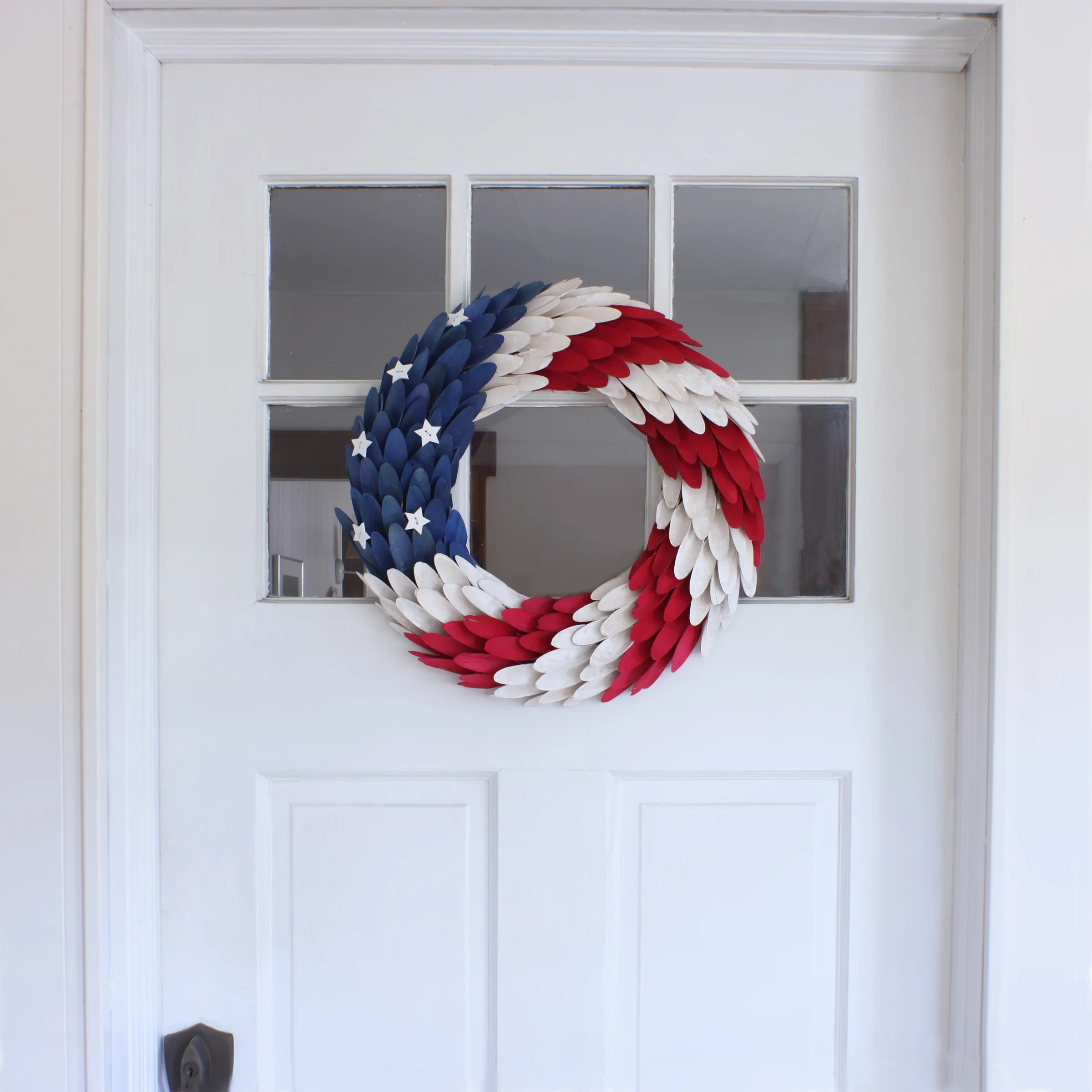 Patriotic Artificial Hanging Wreath Foam Base Decorated with Red White and Blue Wooden Feathers Stars 4th of July Collection 18 Inches - Image 2